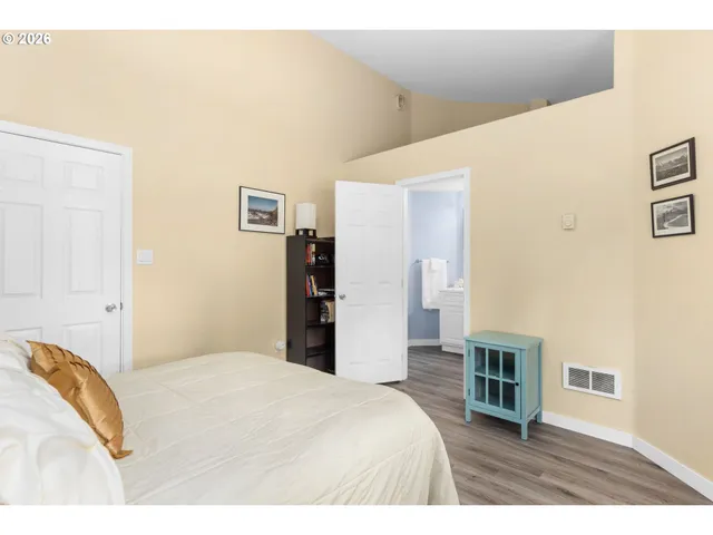 a bedroom with a bed and a cabinets