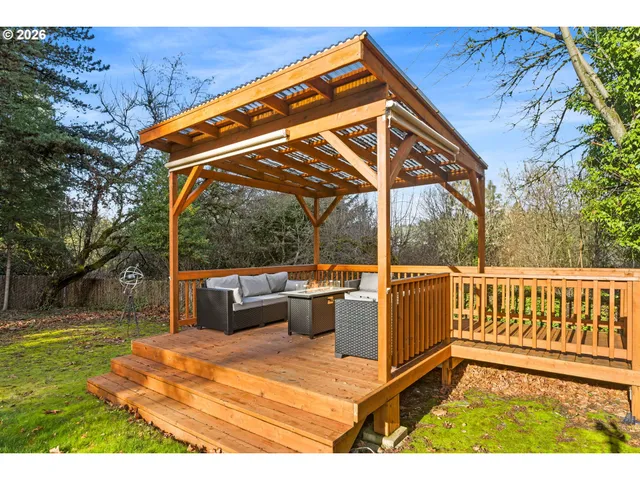a view of a patio with a table and chairs