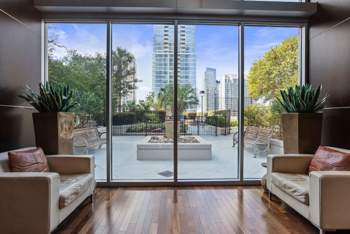 360 Nueces Street, Unit 3904 Austin, TX 78701 - Photo 26 of 32 a living room with couch and a potted plant