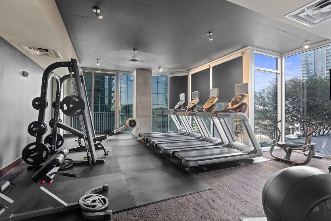 360 Nueces Street, Unit 3904 Austin, TX 78701 - Photo 30 of 32 a bedroom with furniture and a large window