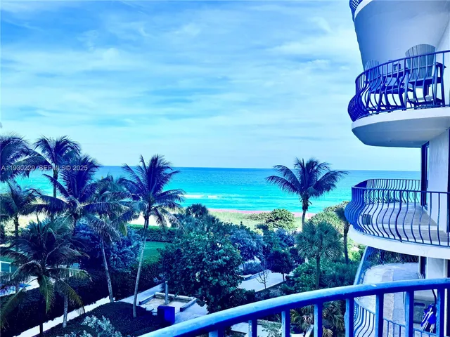 a view of a chairs and table in the patio