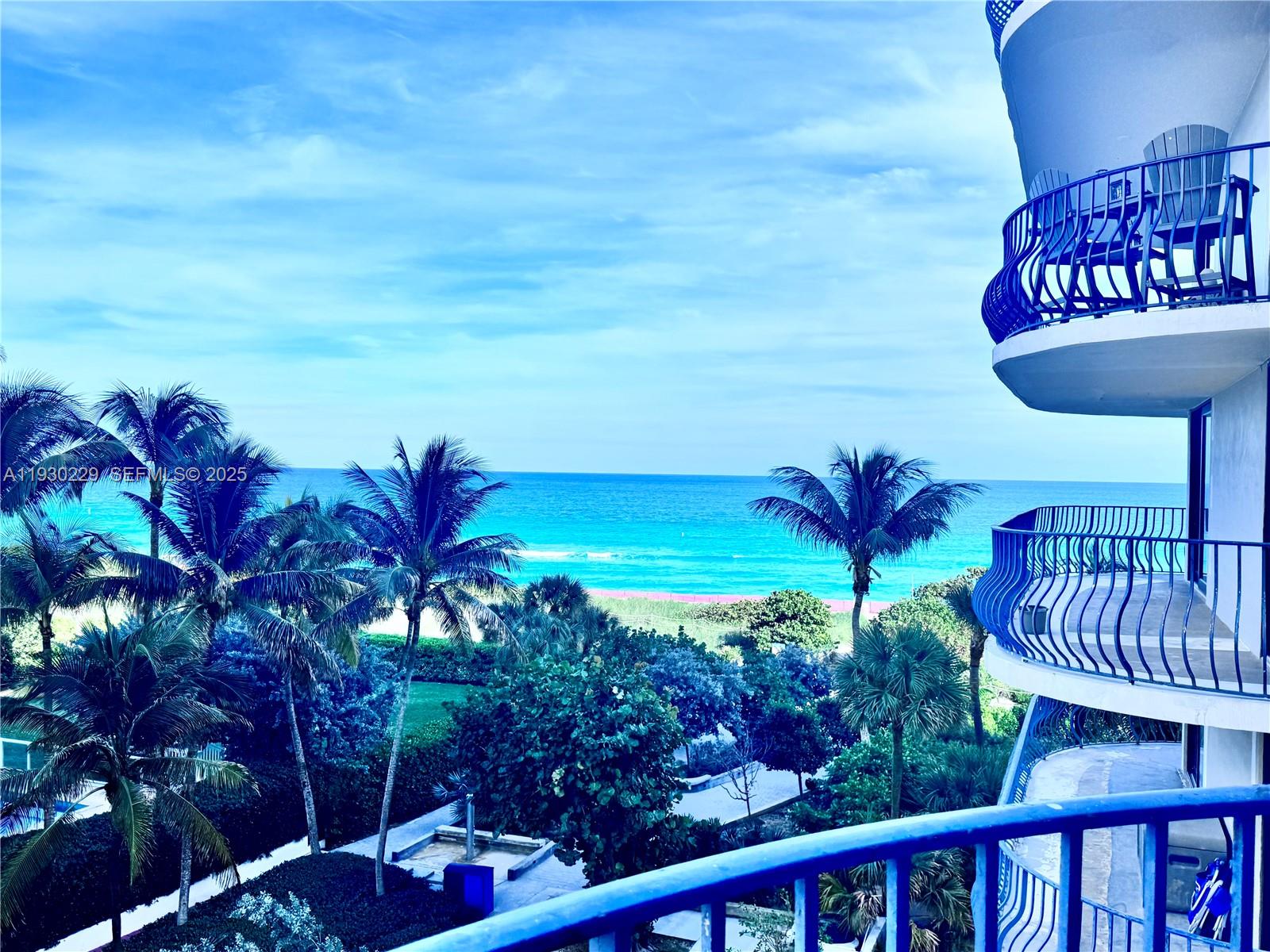 a view of a chairs and table in the patio