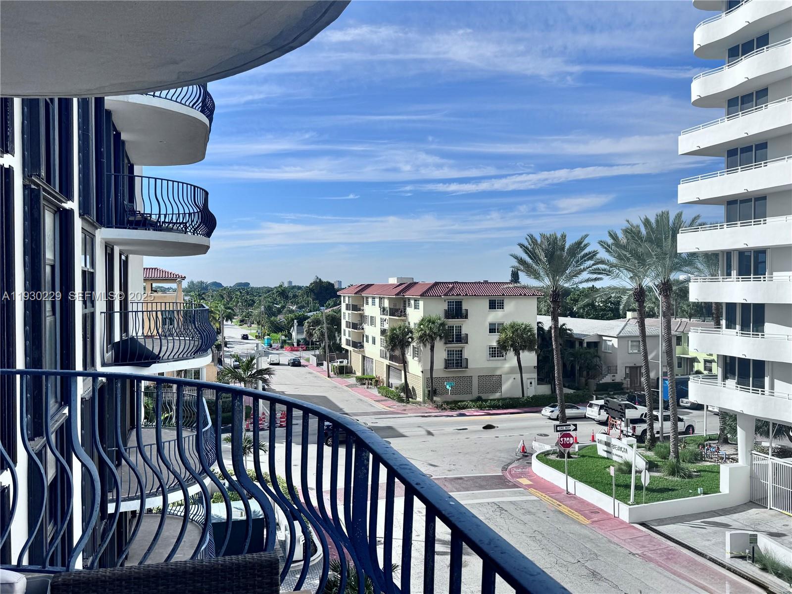 8877 Collins Avenue, Unit 402 Surfside, FL 33154 - Photo 17 of 24 a view of a balcony with chairs