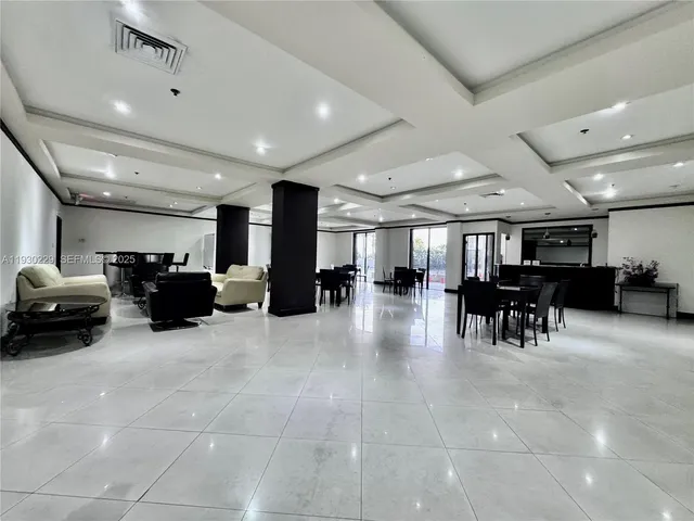 a room with furniture and lots of chairs