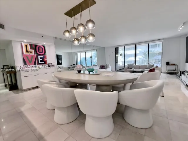 a view of a dining room with furniture and window