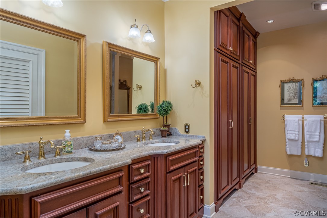 102 Par Drive Williamsburg, VA 23188 - Photo 26 of 42 a bathroom with a granite countertop sink and a mirror