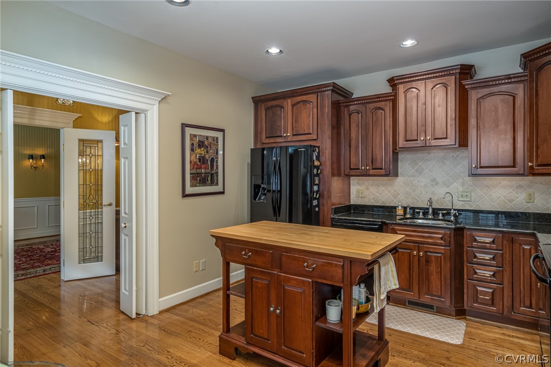 102 Par Drive Williamsburg, VA 23188 - Photo 10 of 42 a kitchen with stainless steel appliances granite countertop a stove top oven a sink and a refrigerator