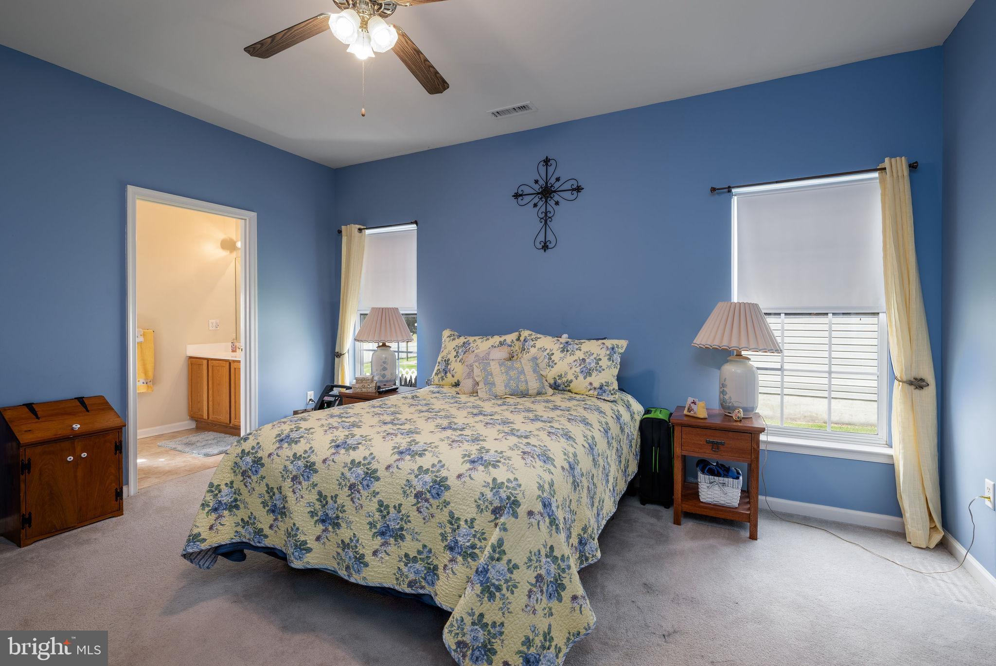 10 Arrowood Knobs Lewes, DE 19958 - Photo 13 of 40 a bedroom with a bed and a window