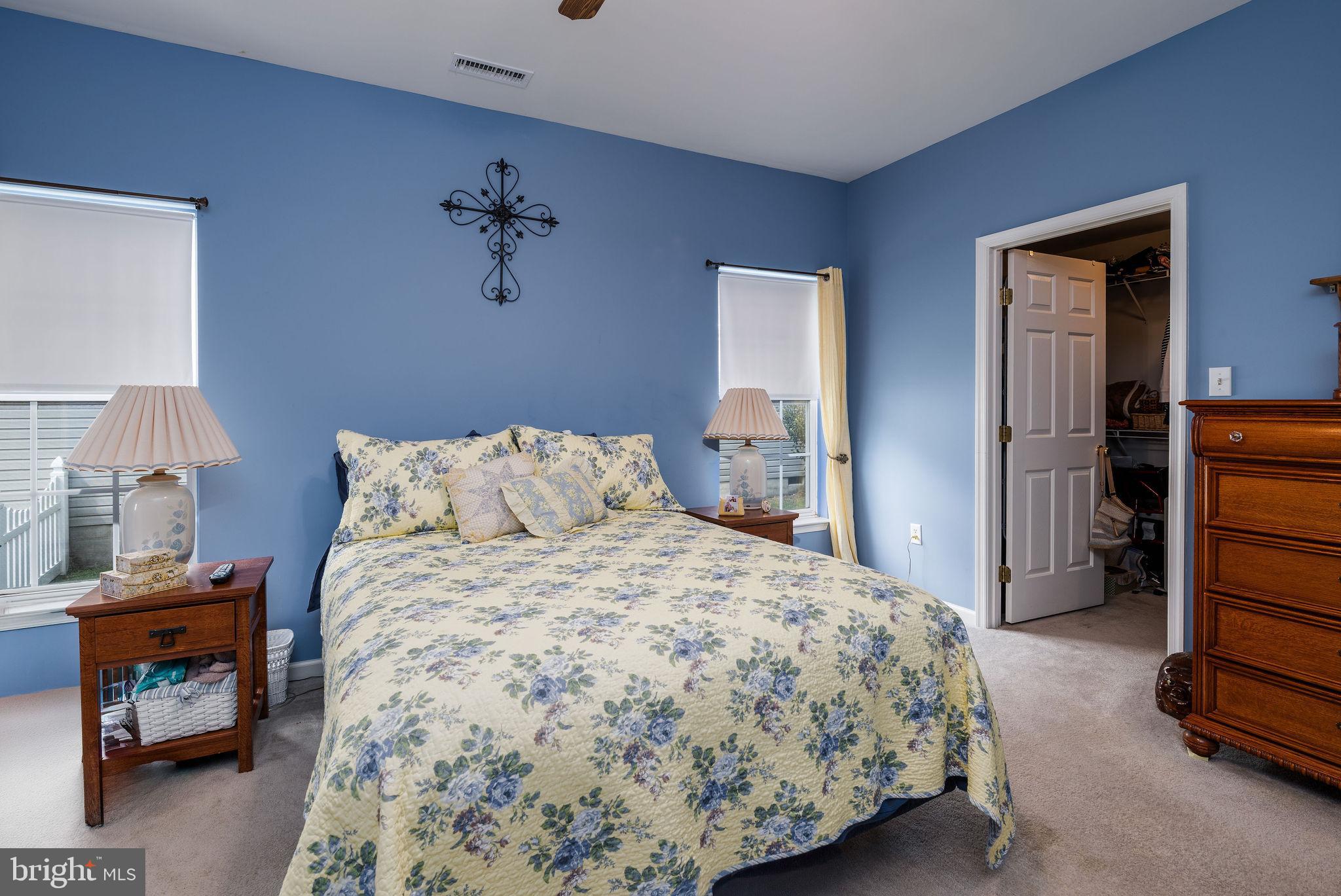 10 Arrowood Knobs Lewes, DE 19958 - Photo 14 of 40 a bedroom with a bed and a lamp