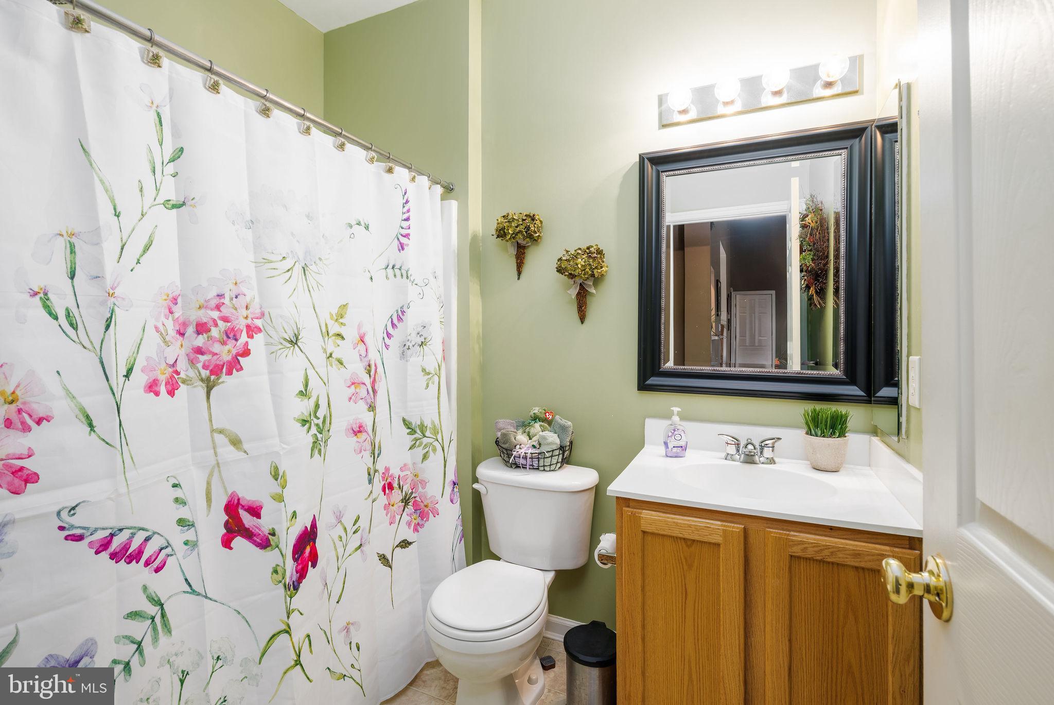 10 Arrowood Knobs Lewes, DE 19958 - Photo 19 of 40 a bathroom with a sink toilet and shower