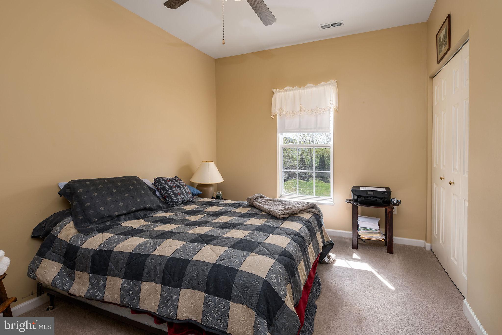 10 Arrowood Knobs Lewes, DE 19958 - Photo 20 of 40 a bedroom with a bed and window