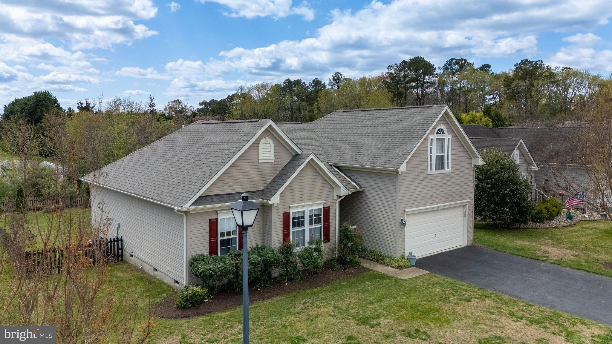 10 Arrowood Knobs Lewes, DE 19958 - Photo 2 of 40 a aerial view of a house next to a yard