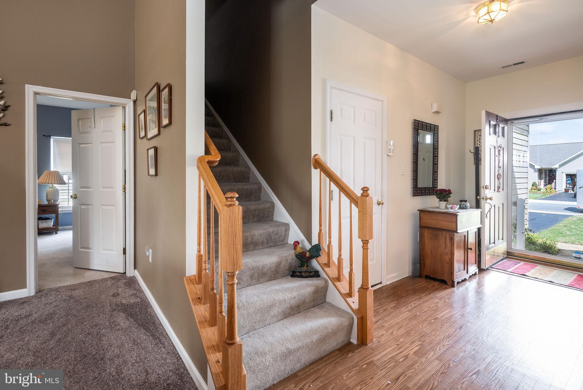 10 Arrowood Knobs Lewes, DE 19958 - Photo 24 of 40 a view of an entryway with wooden floor and a livingroom view