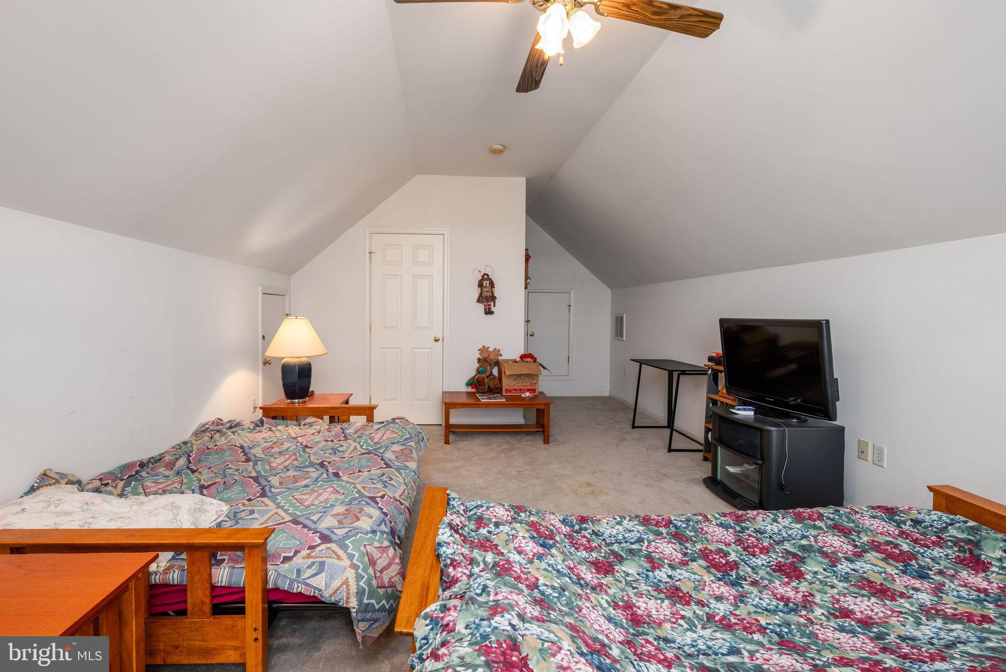 10 Arrowood Knobs Lewes, DE 19958 - Photo 27 of 40 a living room with furniture and a flat screen tv
