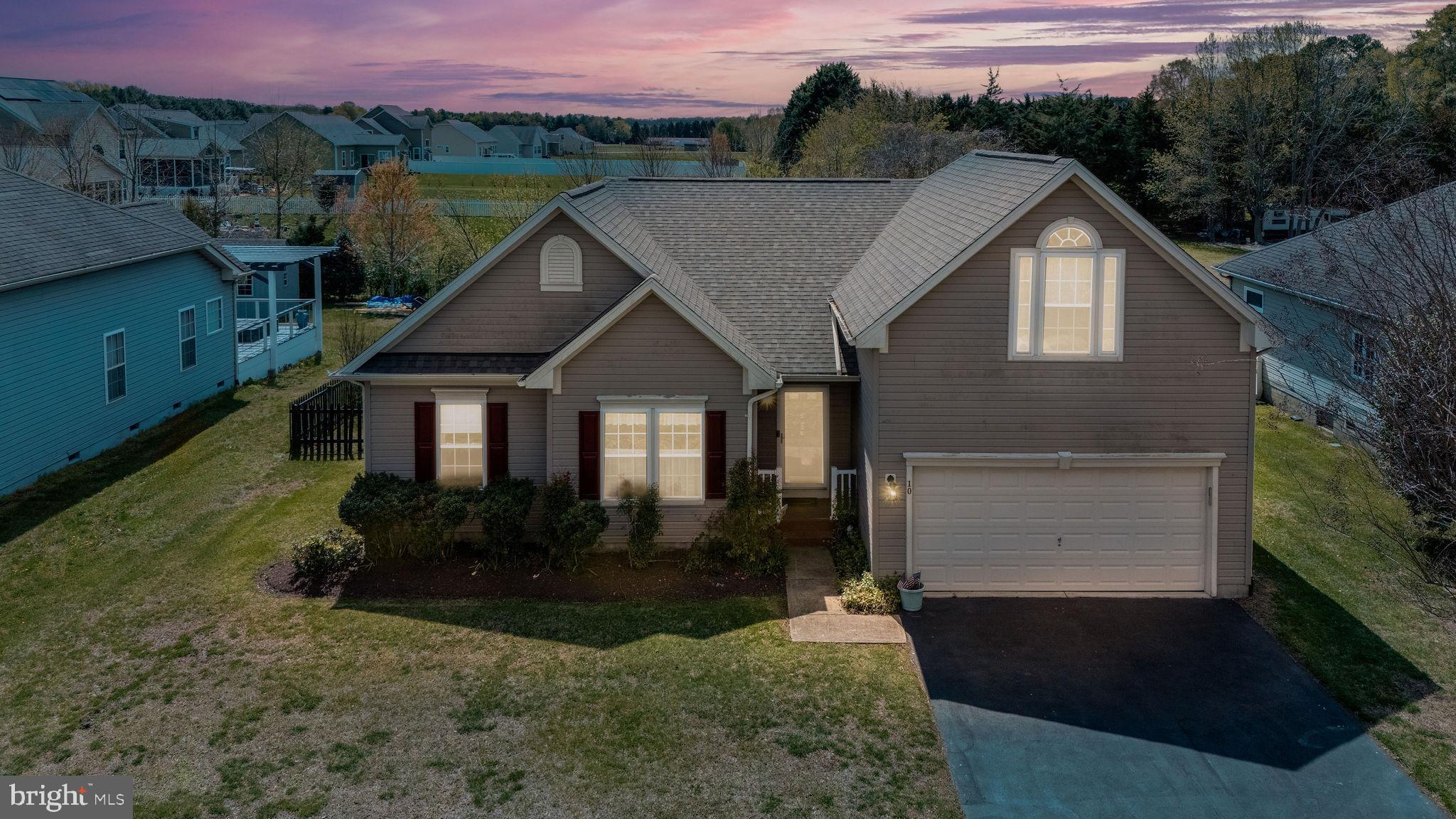 10 Arrowood Knobs Lewes, DE 19958 - Photo 37 of 40 a house with green field in front of it