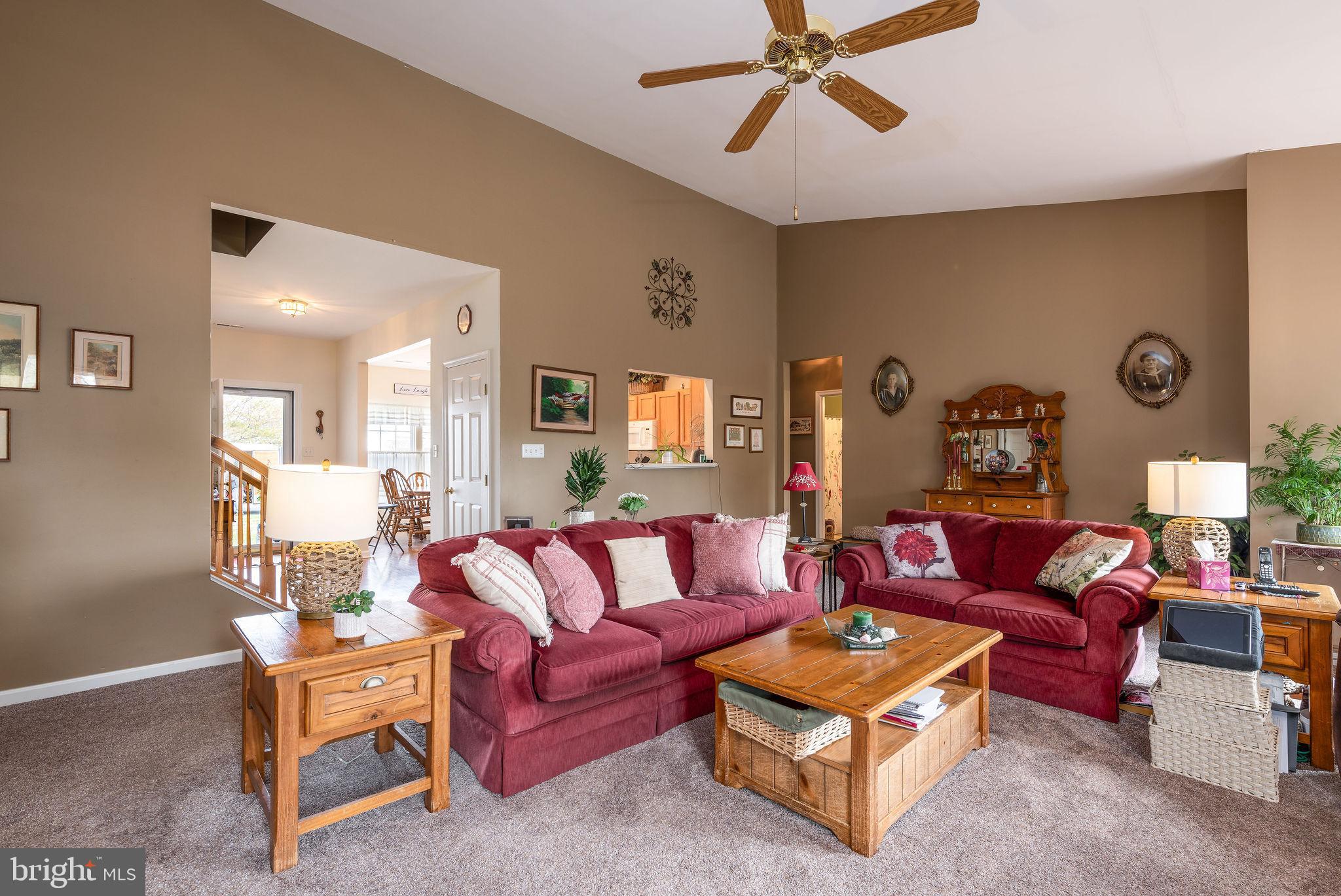10 Arrowood Knobs Lewes, DE 19958 - Photo 9 of 40 a living room with furniture and a ceiling fan