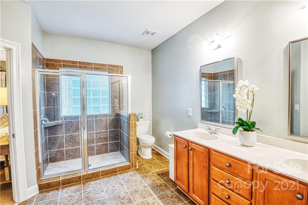 1183 Springmaid Avenue Fort Mill, SC 29708 - Photo 17 of 31 a spacious bathroom with double vanity and a shower