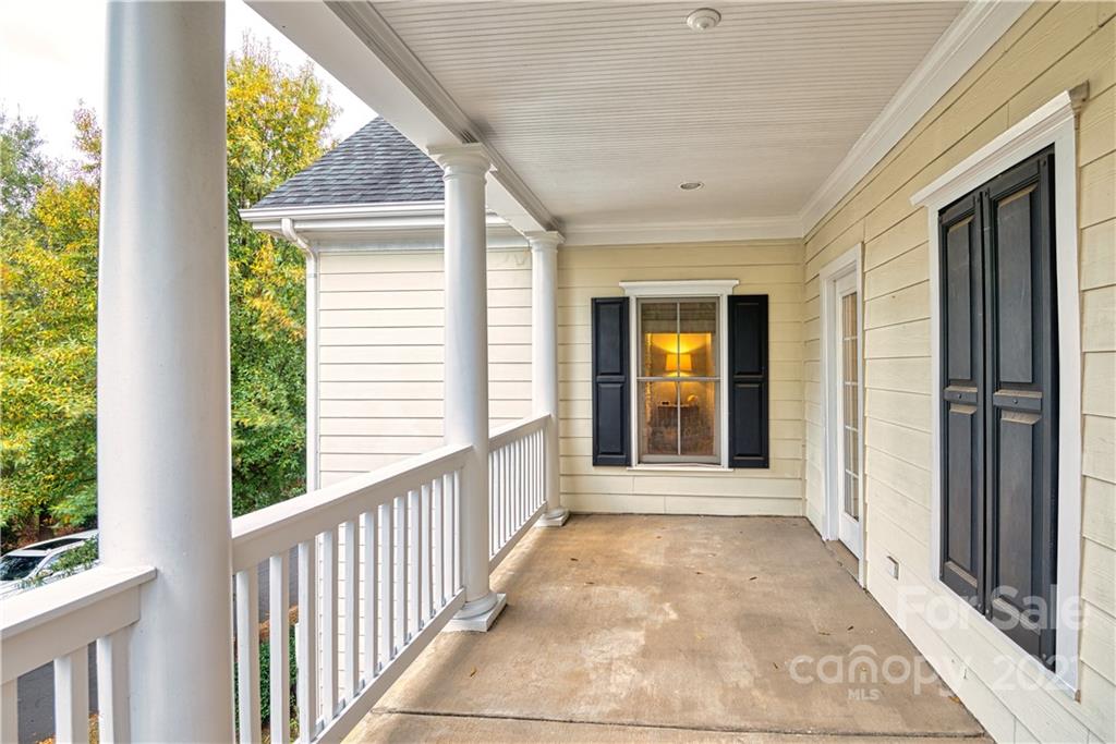 1183 Springmaid Avenue Fort Mill, SC 29708 - Photo 18 of 31 a view of a porch with wooden floor and front door