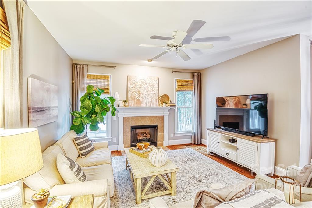 1183 Springmaid Avenue Fort Mill, SC 29708 - Photo 6 of 31 a living room with furniture and a fireplace