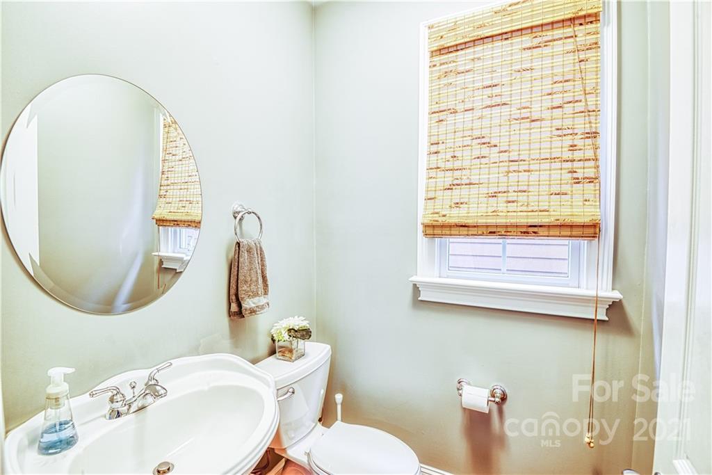 1183 Springmaid Avenue Fort Mill, SC 29708 - Photo 9 of 31 a bathroom with a toilet mirror and a sink