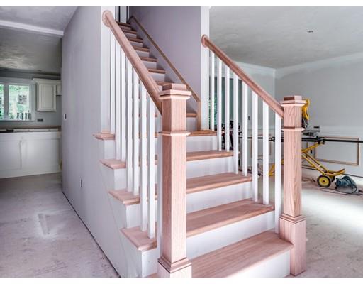 101 Glenwood Road Rutland, MA 01543 - Photo 13 of 23 a view of staircase with lots of frames of living room and a rug