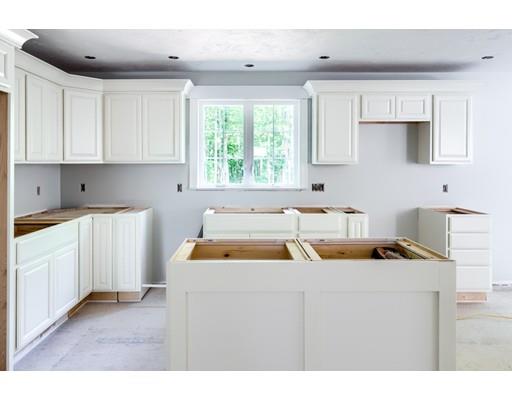 101 Glenwood Road Rutland, MA 01543 - Photo 3 of 23 a kitchen with a sink a stove and white cabinets