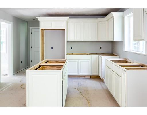 101 Glenwood Road Rutland, MA 01543 - Photo 5 of 23 a kitchen with a stove a sink and a refrigerator