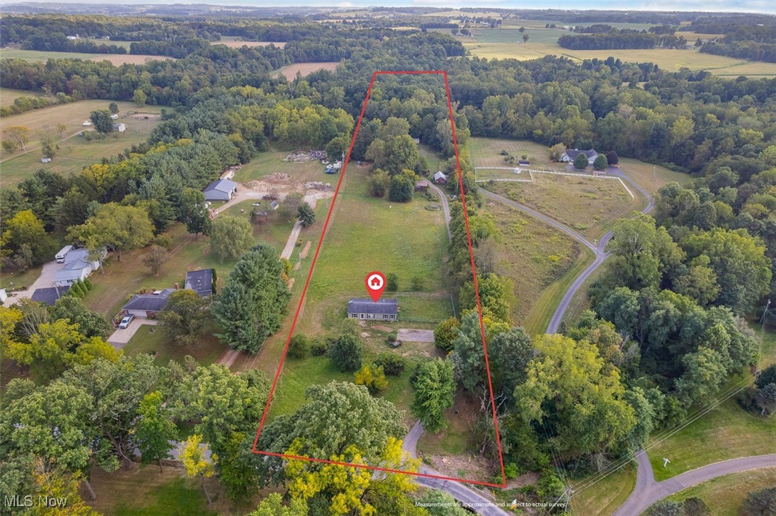5277 Secrest Road Wooster, OH 44691 - Photo 5 of 9 View of rural area with property parcel outlined and a tree filled landscape