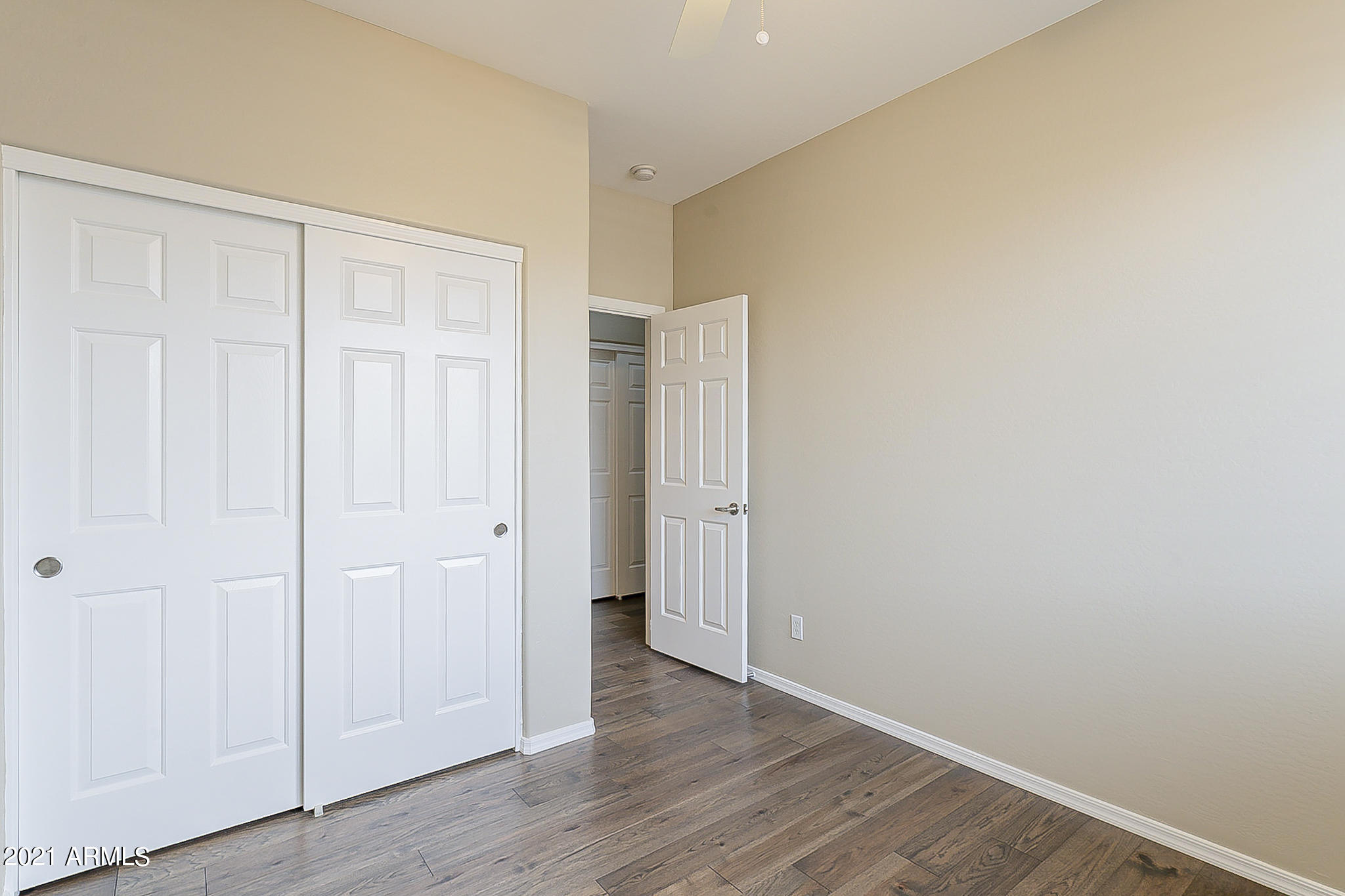 15346 West Boca Raton Road Surprise, AZ 85379 - Photo 39 of 45 a view of an empty room with wooden floor