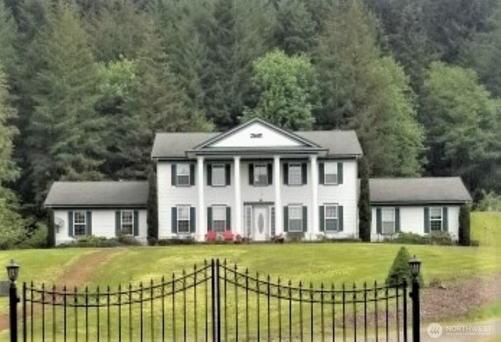 12832 Hunter Road Southwest Rochester, WA 98579 - Photo 1 of 33 a front view of a house with a garden