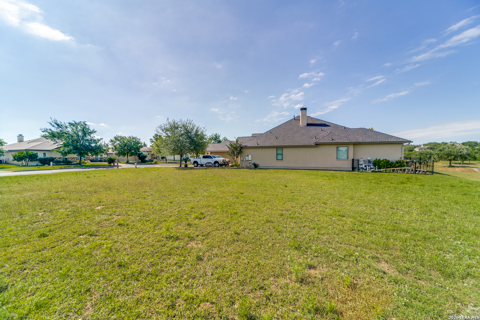 30015 Cibolo Path Fair Oaks Ranch, TX 78015 - Photo 8 of 11 a front view of a house with a yard