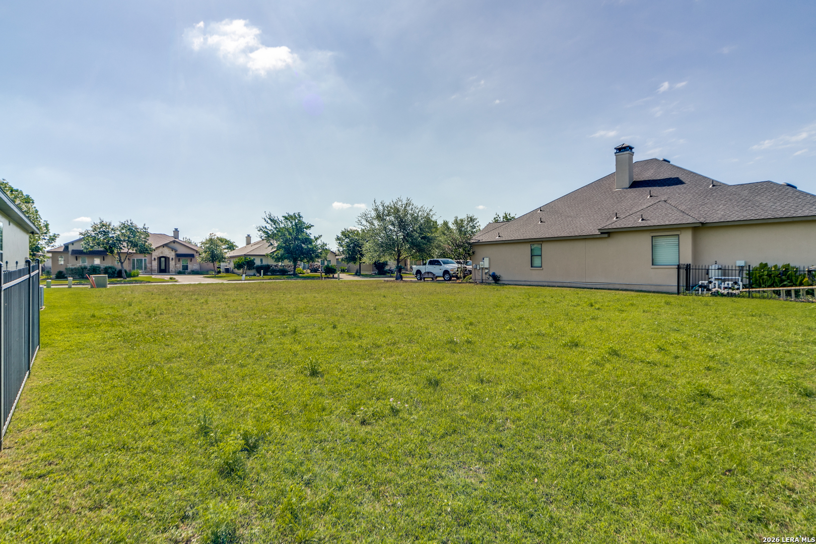30015 Cibolo Path Fair Oaks Ranch, TX 78015 - Photo 9 of 11 a view of a house with a yard