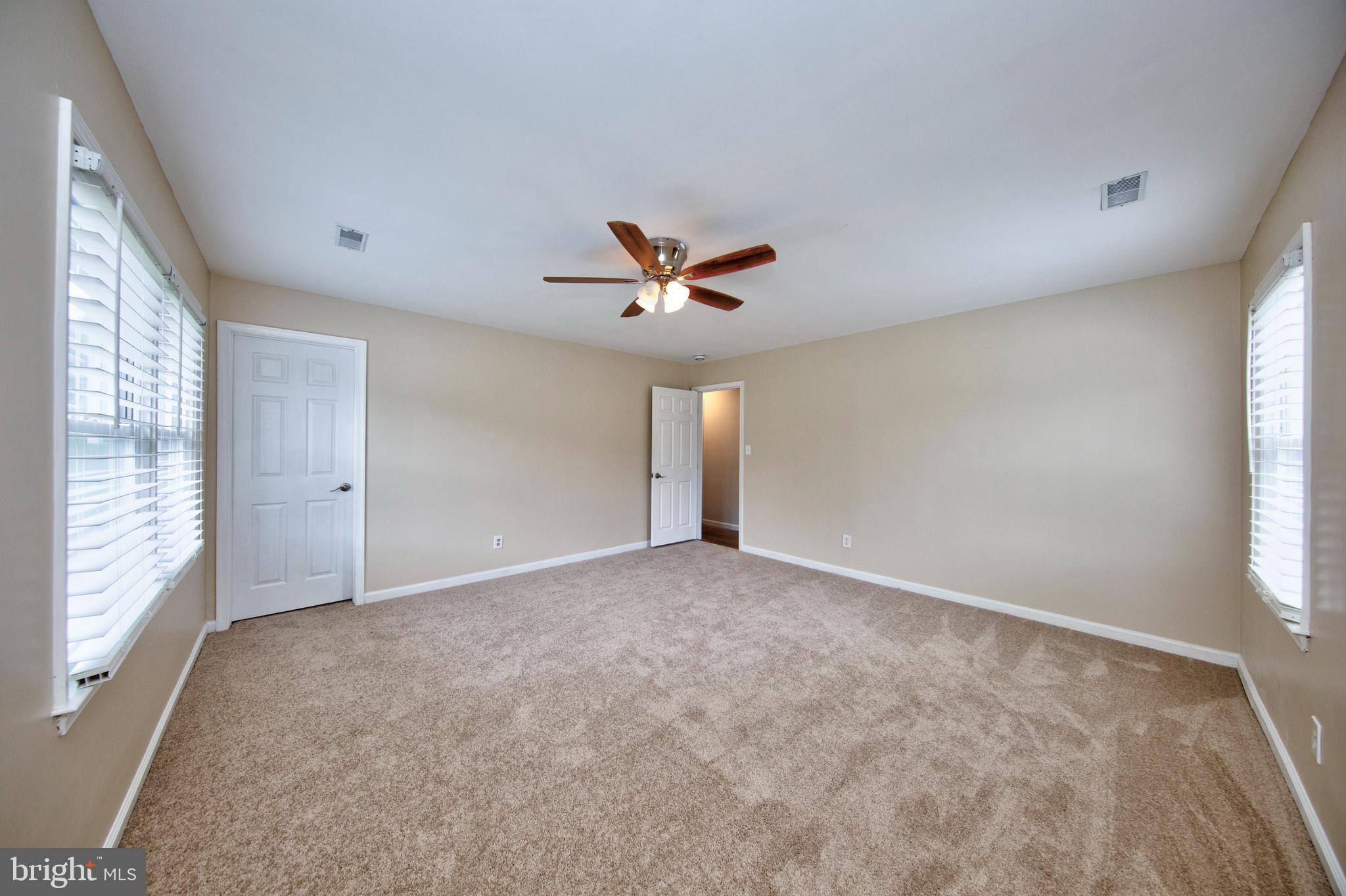 1301 Philadelphia Road Joppa, MD 21085 - Photo 28 of 54 Primary bedroom w/ new carpet & fresh paint