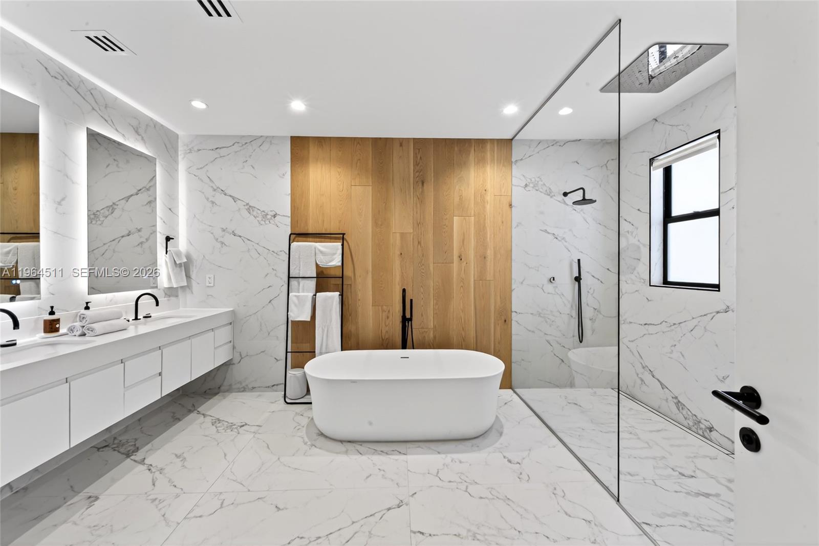 7500 Southwest 55th Avenue Miami, FL 33143 - Photo 36 of 48 a spacious bathroom with a tub shower and mirror