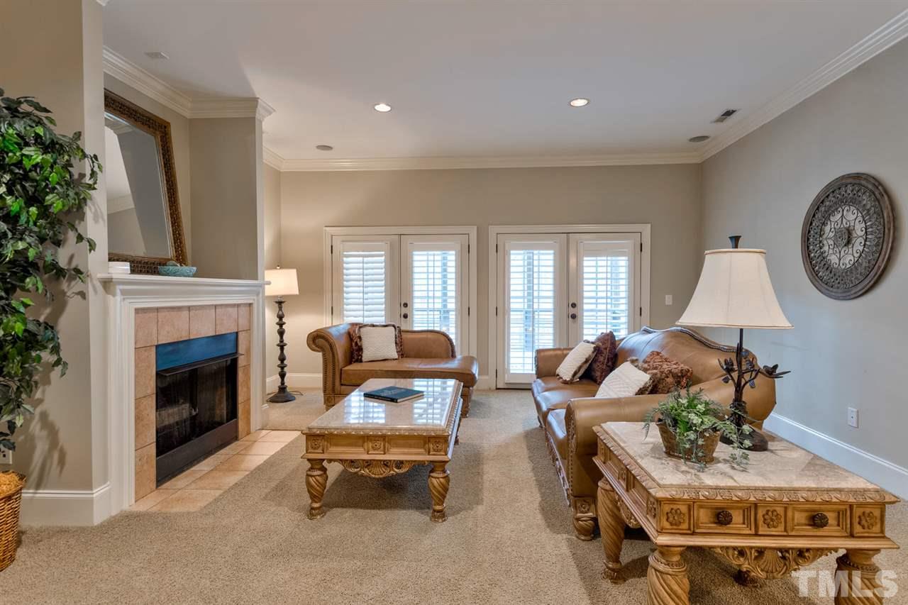 11100 Brass Kettle Road Raleigh, NC 27614 - Photo 20 of 30 Cozy gas log Fireplace and lovely french doors to the lower level deck and backyard