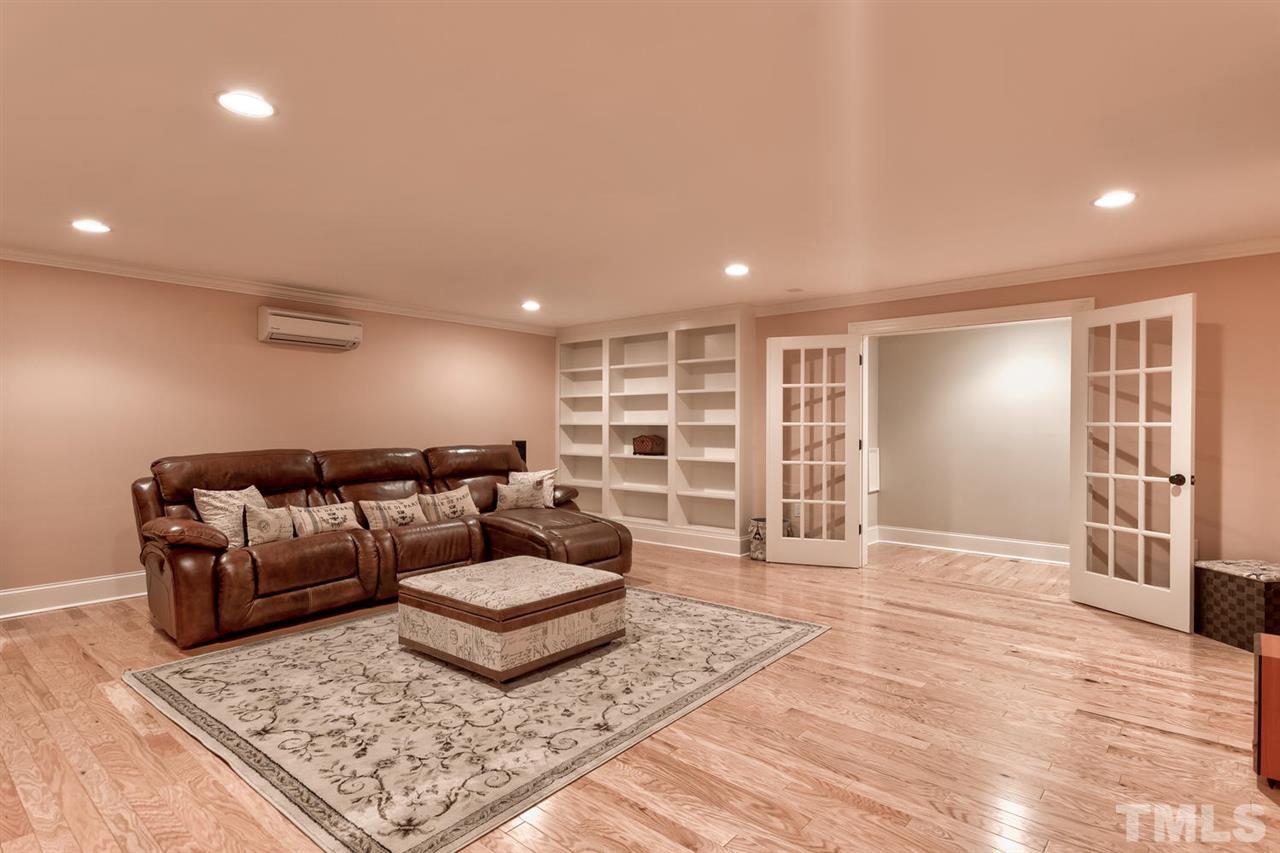 11100 Brass Kettle Road Raleigh, NC 27614 - Photo 23 of 30 This media room features a secret room, perfect for a safe room!