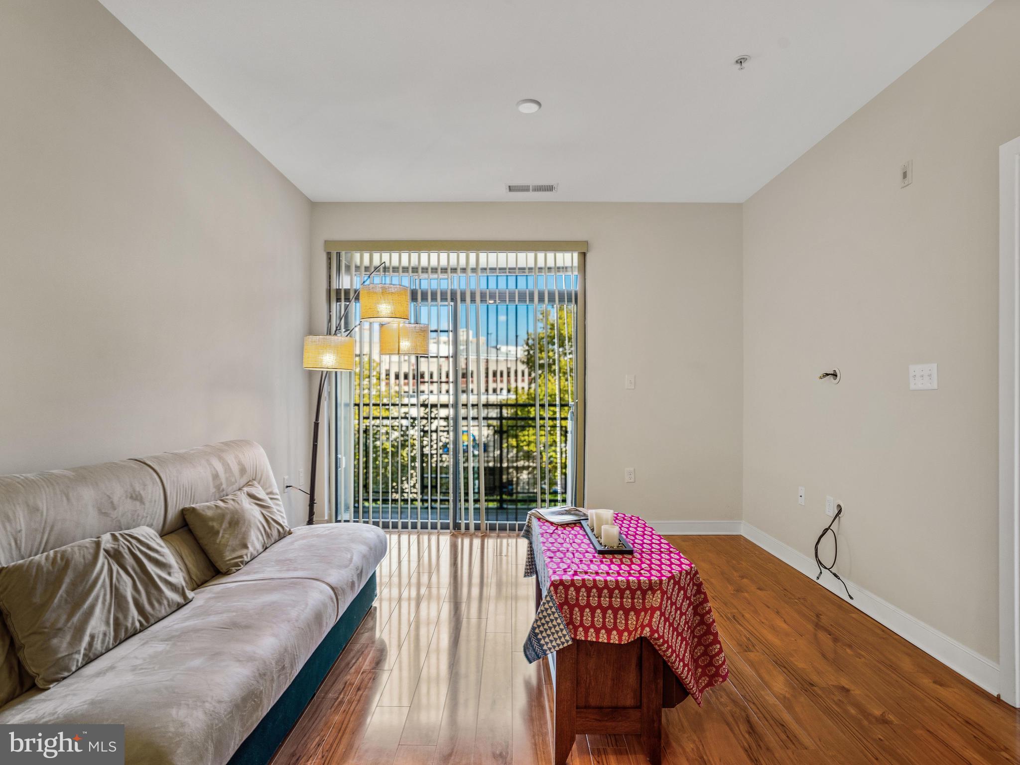 8005 13th Street, Unit 304 Silver Spring, MD 20910 - Photo 6 of 31 Gleaning hardwood floors & a bright interior.