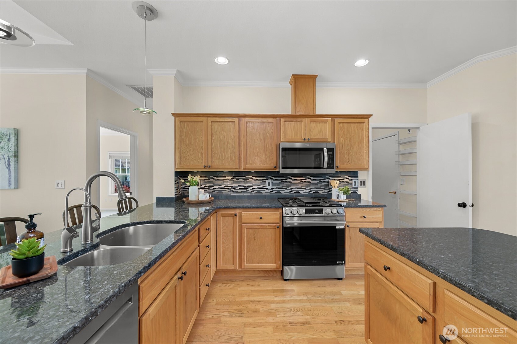 500 Fieldstone Loop, Unit 14 Lynden, WA 98264 - Photo 10 of 25 a kitchen with stainless steel appliances granite countertop a sink a stove top oven a counter space and cabinets