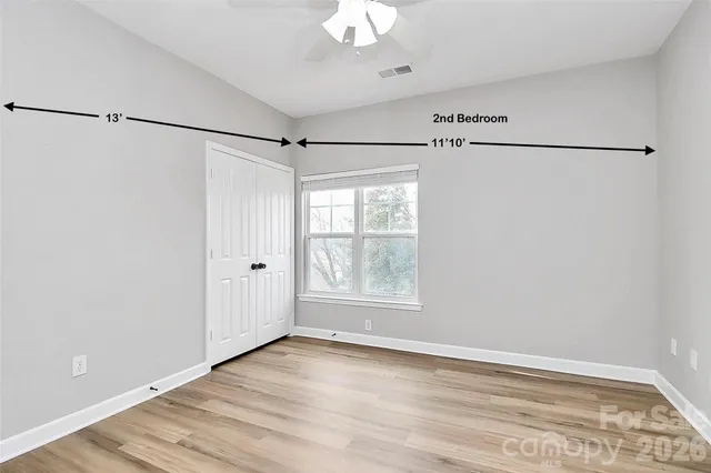 a view of a room with an empty walk in closet