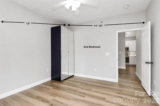 a view of a room with an empty walk in closet
