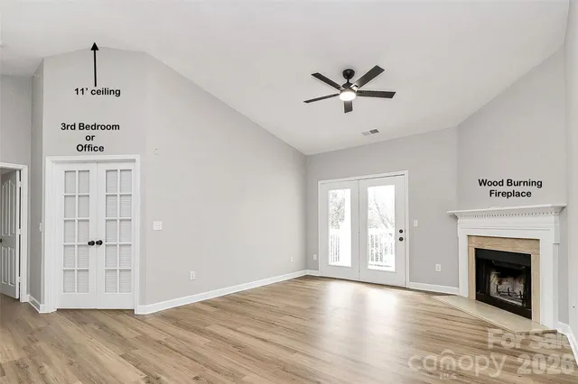 an empty room with a empty space and windows