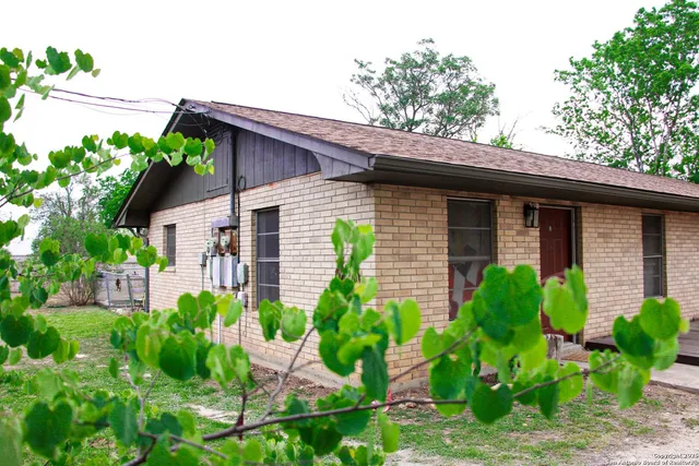 a house with trees in the background