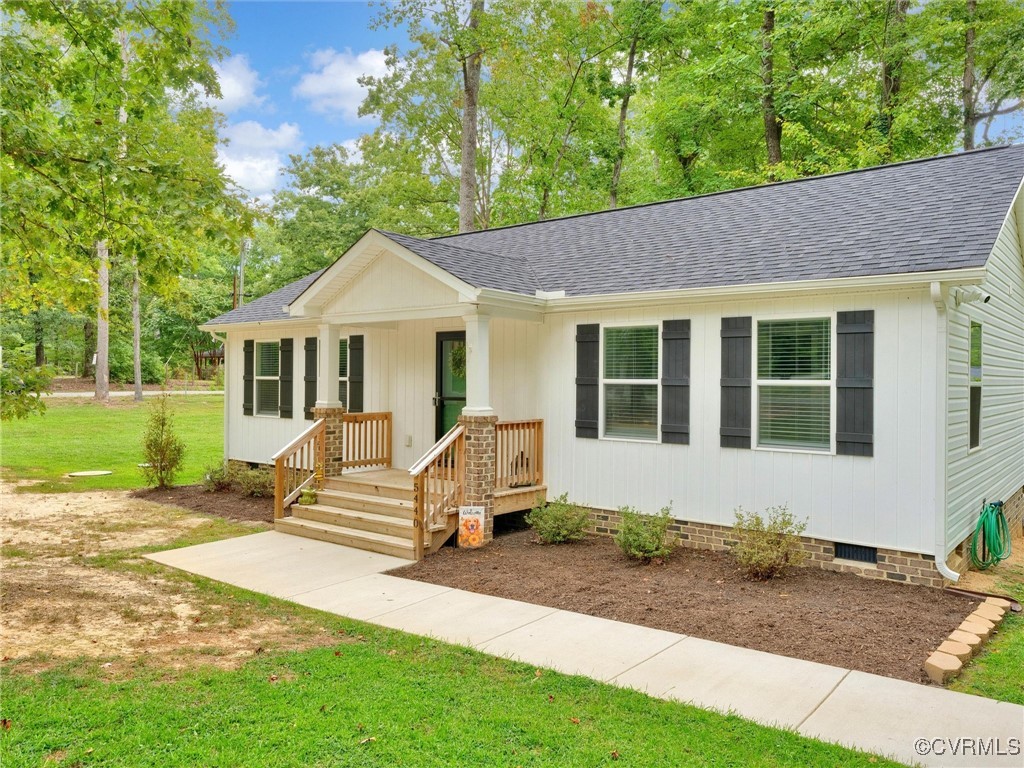 a front view of a house with a yard outdoor seating and yard