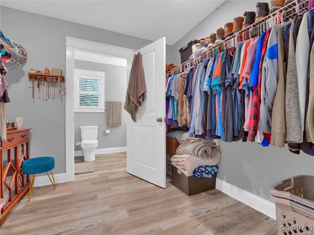 5440 New Line Road Gum Spring, VA 23065 - Photo 15 of 28 a walk in closet with clothes and shoes