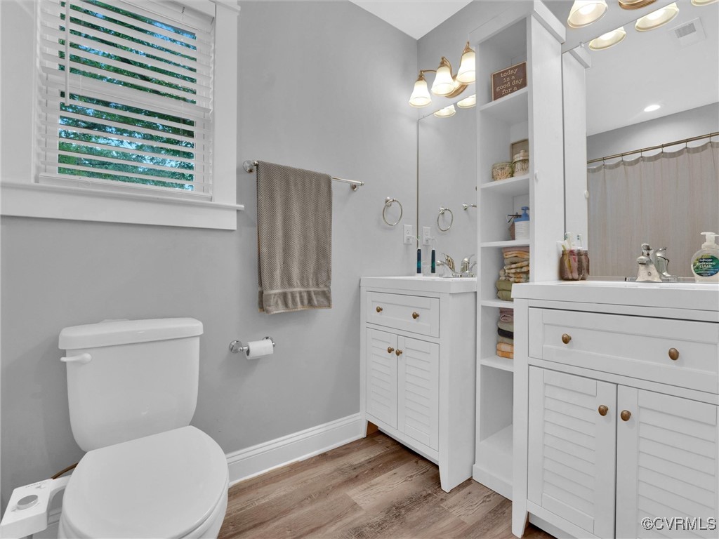 5440 New Line Road Gum Spring, VA 23065 - Photo 16 of 28 a bathroom with a toilet sink and mirror