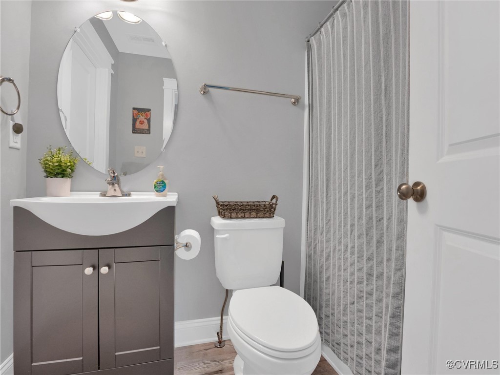 5440 New Line Road Gum Spring, VA 23065 - Photo 23 of 28 a bathroom with a sink a toilet and shower