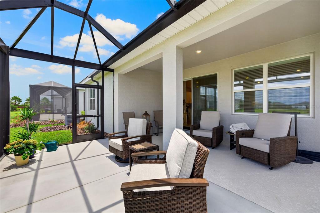 18237 Beach Ranch Terrace Bradenton, FL 34211 - Photo 52 of 72 a outdoor living space with furniture