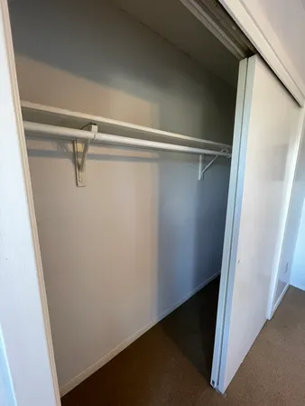 a view of a room with racks on the wall