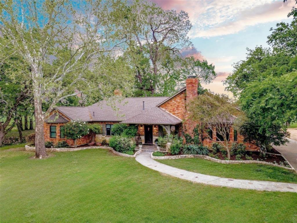 10200 North County Road Frisco, TX 75033 - Photo 1 of 25 a view of a house with a yard table and chairs