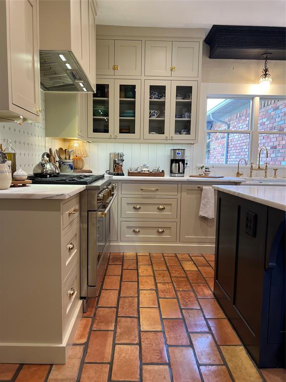 10200 North County Road Frisco, TX 75033 - Photo 11 of 25 a kitchen with stainless steel appliances a stove sink and cabinets